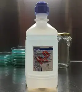 Distilled water 1000ml bottle on a laboratory table, ideal for adding humidity to mushrooms and misting mushroom grow kits